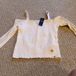 Cold shoulder long sleeve shirt.